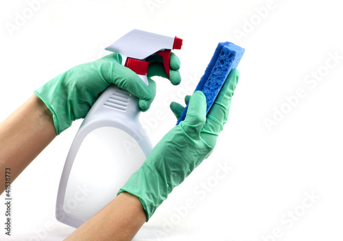 Photo: Gloved hands with sponge and cleaning spray Gloved hands with sponge and cleaning spray