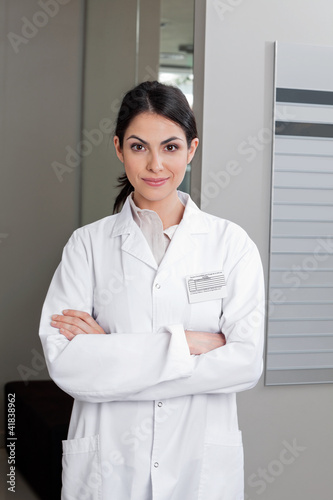 Photo: Female Optometrist With Arms Crossed Female Optometrist With Arms Crossed