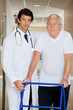 Doctor Helping An Old Man With His Walker Doctor Helping An Old Man With His Walker