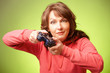 Beautiful womanl with gamepad playing vieogame