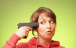 Woman with pistol pointing on her head
