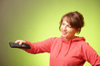 Beautiful woman using a remote controller