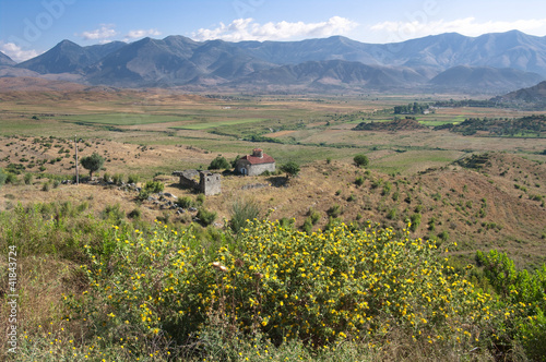 rural landscape of southern Albania on the background a mountain range