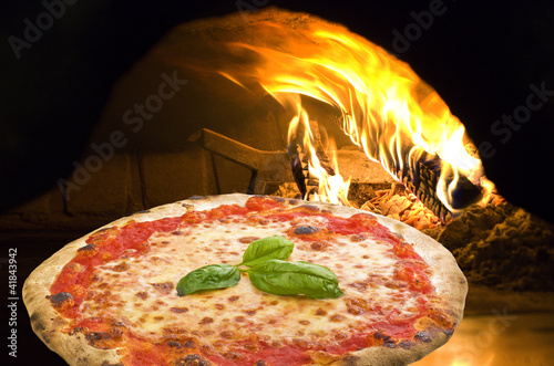 Photo: Pizza Margherita in a pizza oven Pizza Margherita in a pizza oven
