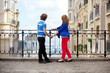 Couple of young tourists on Montmartre enjoying the view from th