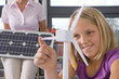 Curious student studying about wind turbines in school classroom