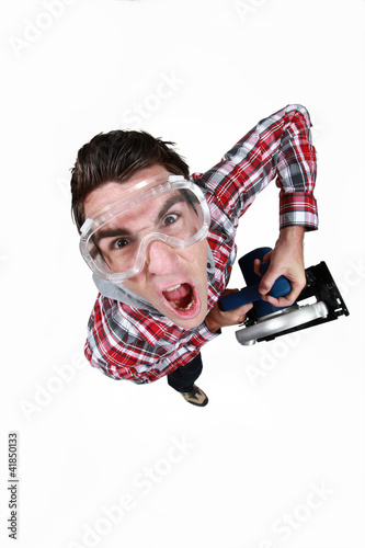 Photo: high angle shot of tradesman wearing goggles in fist of rage high angle shot of tradesman wearing goggles in fist of rage