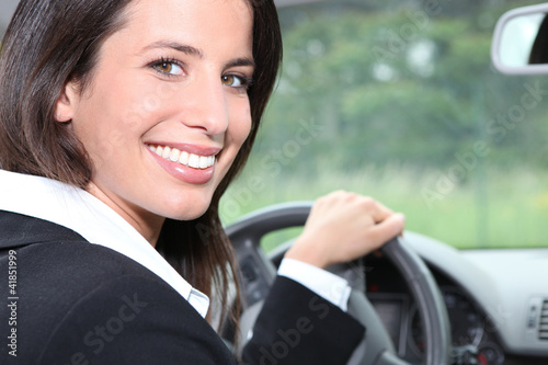 Photo: Salesperson driving a car Salesperson driving a car