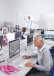 Serious adult student studying in college evening class computer lab