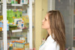 Pharmacy chemist woman in drugstore