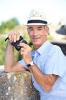 Senior man with a pair of binoculars