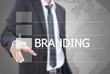 Businessman pushing Branding word on the whiteboard.