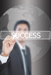 Businessman write Success word on the whiteboard.