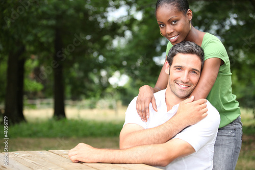 Photo: Racially mixed couple in the forest Racially mixed couple in the forest