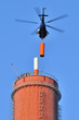 TV transmitter installation on the chimney with a helicopter. TV transmitter installation on the chimney with a helicopter.