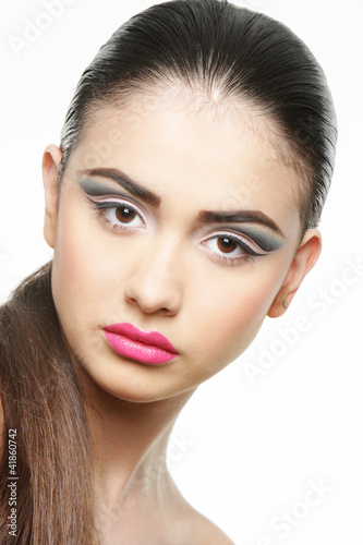 Photo: studio portrait of young beautiful woman with bright makeup isol studio portrait of young beautiful woman with bright makeup isol