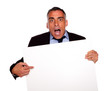 Surprised businessman pointing a card