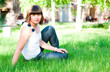 young girl sitting on grass