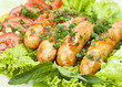 sausage with lettuce leaves, close-up