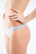 Foto: Slim tanned woman's body isolated over gray background. Healthy Slim tanned woman's body isolated over gray background. Healthy