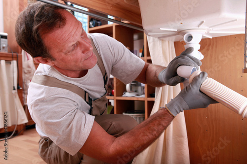 Photo: Plumbers repairing leak Plumbers repairing leak