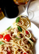 spaghetti with tuna fish and basil in a fork spaghetti with tuna fish and basil in a fork