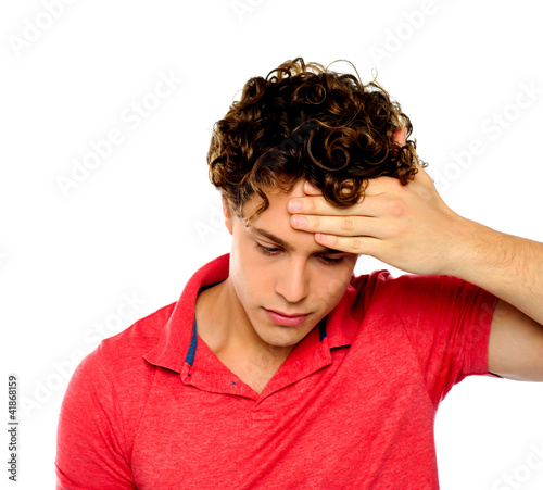 Photo: Stressed out guy with hand on his forehead Stressed out guy with hand on his forehead