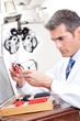 Optometrist Holding Measuring Eye Glasses