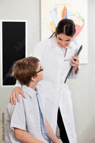 Photo: Boy With Vision Problems Consulting To Optometrist Boy With Vision Problems Consulting To Optometrist