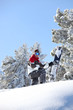 Man snowboarding down snowy hill