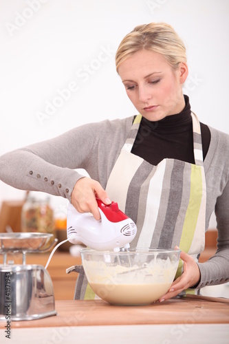 Photo: Woman whisking batter Woman whisking batter