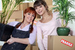 Young women moving into their new apartment
