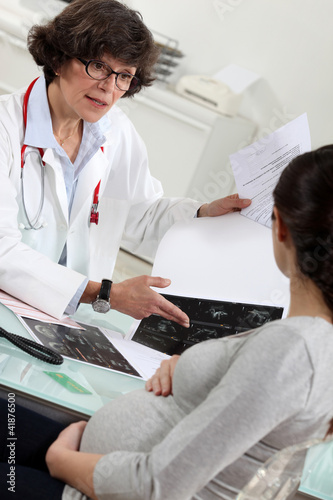 Photo: Pregnant patient receiving the results of a scan Pregnant patient receiving the results of a scan