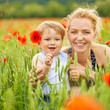 Foto: Mother and son in poppy field Mother and son in poppy field