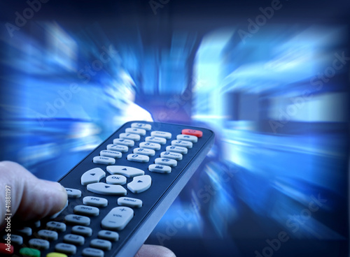 Photo: Watching tv with remote control Watching tv with remote control