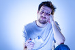 Bored Man Playing Videogames with Gamepad