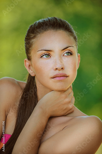Photo: woman with bare shoulders looked thoughtfully at thoron woman with bare shoulders looked thoughtfully at thoron