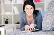 Woman lying on couch and reading a book Woman lying on couch and reading a book