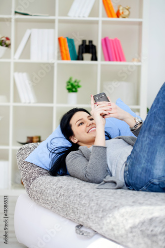 Photo: girl texting message on phone girl texting message on phone