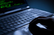 Hacker stealing data from a laptop