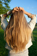 Foto: Young woman with helthy, long, blond hair Young woman with helthy, long, blond hair