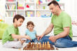 Whoa - that is awsome, toddler boy looking at chess game