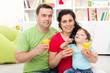 Family with child having fruit juice