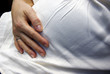 Pregnant lady holding her belly
