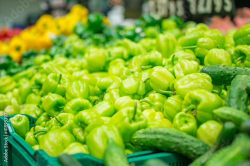 Photo: Variety of peppers in boxes in supermarket Variety of peppers in boxes in supermarket