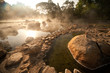 Smoke rising from hot springs in Northern of Thailand..