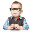 Portrait of a cute little boy wearing glasses