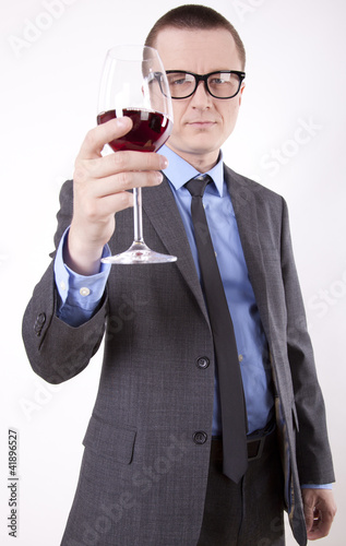Photo: Young business man with a glass of wine Young business man with a glass of wine