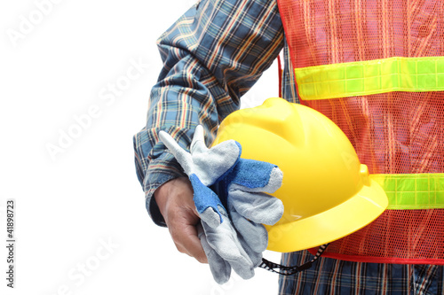 Photo: man holding yellow helmet over white man holding yellow helmet over white