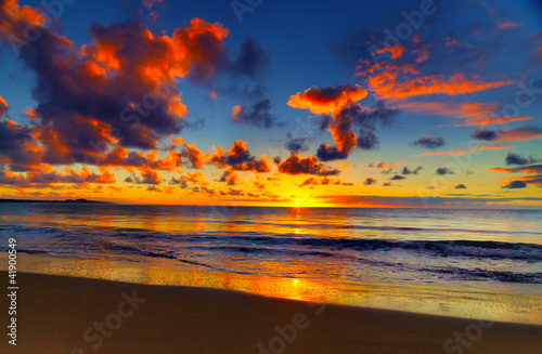 Photo: Beautiful tropical sunset on the beach Beautiful tropical sunset on the beach